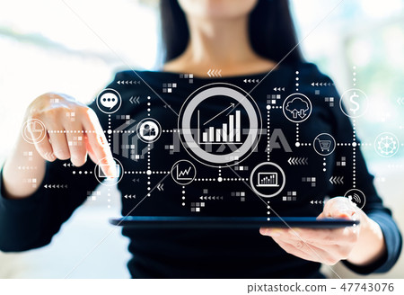 Marketing concept with woman using tablet Marketing concept with woman using tablet 47743076