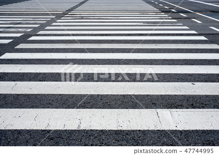 Crosswalk pedestrian crossing in the street 47744995