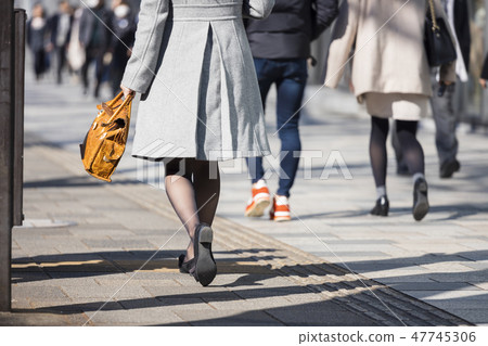 A woman walking in Omotesando A woman walking in Omotesando 47745306