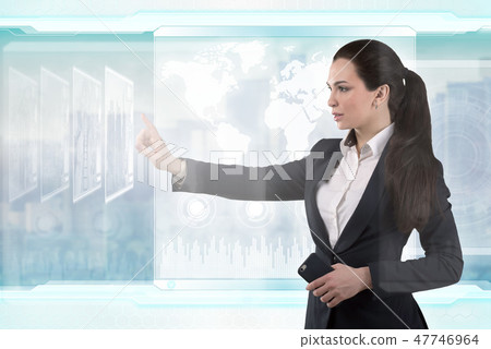 Beautiful business lady works with virtual graphic interface. Futuristic office Beautiful business lady works with virtual graphic interface. Futuristic office 47746964