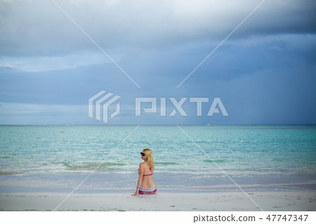 Young sexy blonde woman in bikini near sea 47747347