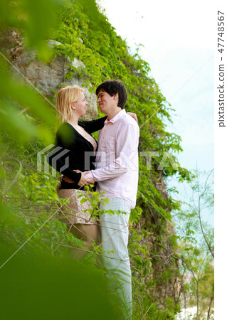 Young sexy blonde woman and man at romantic date at vacation 47748567