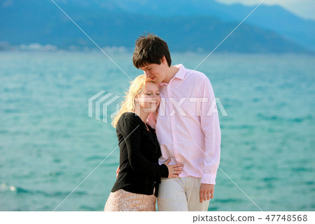 Young sexy blonde woman and man at romantic date at vacation 47748568