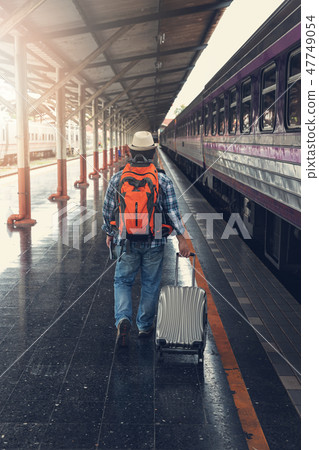 Asian traveler man with belongings Asian traveler man with belongings 47749054