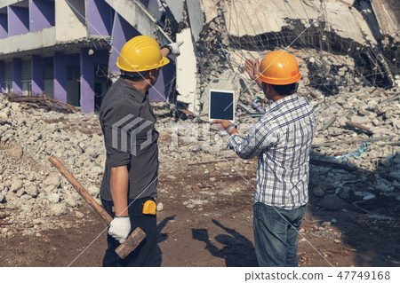 Engineer operation control demolish old building. Engineer operation control demolish old building. 47749168