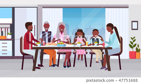 multi generation family sitting around table eating meal together happy african american multi generation family sitting around table eating meal together happy african american 47751688