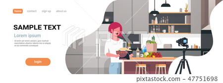 girl food blogger recording video on camera woman preparing tasty dish modern kitchen interior 47751698