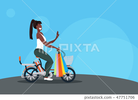 woman cycling bicycle carrying colorful paper bags purchases shopping concept african american girl 47751706