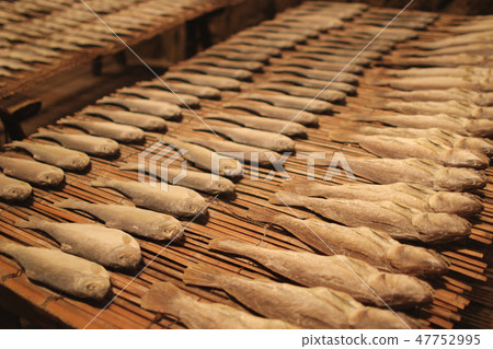 Salty dry river fish on a wooden impressive 47752995