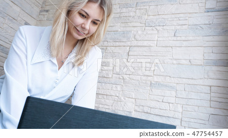 Side view. Young business woman with notebook Side view. Young business woman with notebook 47754457