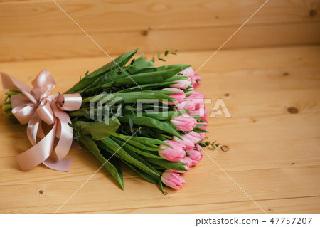Bright pink flowers on wooden background. Colorful bouquet for Mothers Day, Birthday, International Bright pink flowers on wooden background. Colorful bouquet for Mothers Day, Birthday, International 47757207