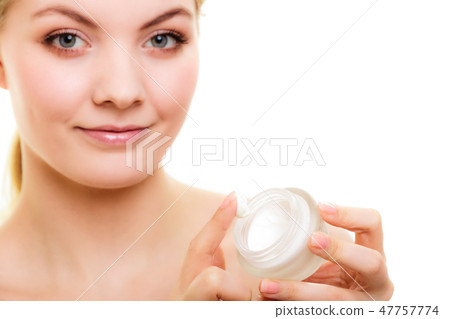 Skin care. Girl applying moisturizing cream 47757774