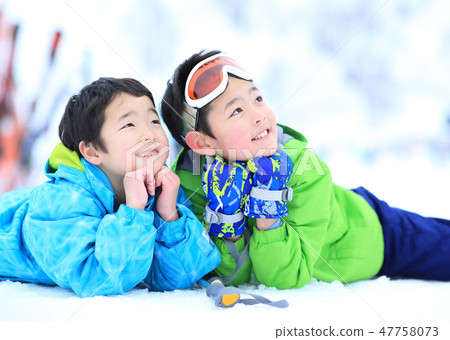 Child wearing ski wear Child wearing ski wear 47758073