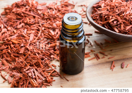 A bottle of red sandalwood essential oil 47758795
