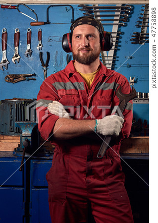 Closeup of auto mechanic on background with tools Closeup of auto mechanic on background with tools 47758898