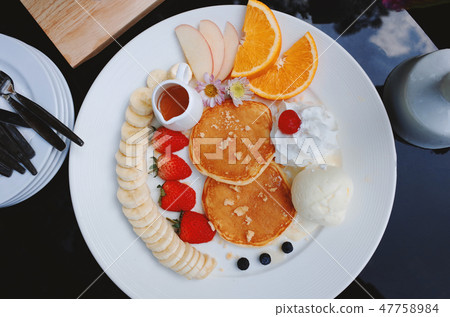 Fruit Pancakes with maple syrup 47758984