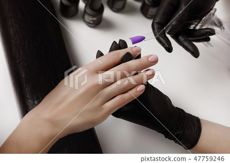 Master of manicure in black gloves, pick up Master of manicure in black gloves, pick up 47759246