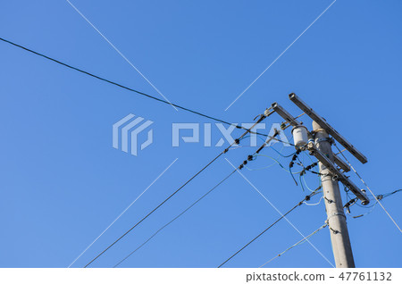 Cable, utility pole and blue sky 47761132
