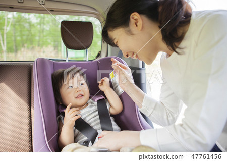 Baby sitting on a child seat Baby sitting on a child seat 47761456
