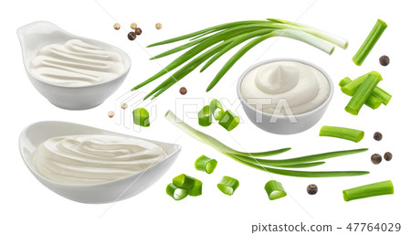 Sour cream and chives isolated on white background, green onion with sour cream sauce 47764029