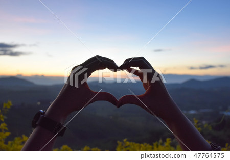 look through hand and heart,mountain sun and sky look through hand and heart,mountain sun and sky 47764575