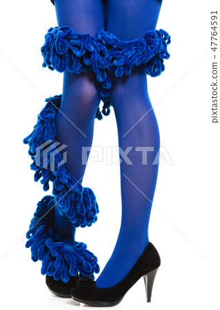 Woman long legs and blue stockings isolated Woman long legs and blue stockings isolated 47764591