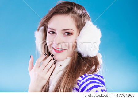 Young woman in wintertime. Young woman in wintertime. 47764963