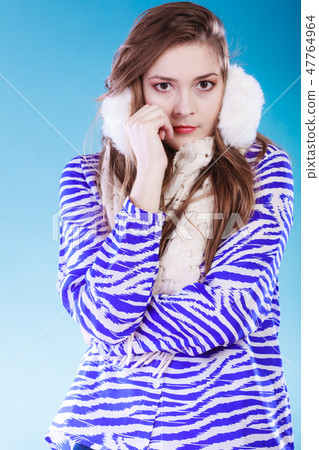 Young woman in wintertime. Young woman in wintertime. 47764964