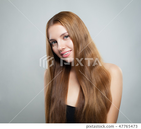 Beautiful Smiling Woman With Long Natural Hair Stock Photo