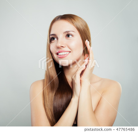 Beautiful face. Young woman with healthy hair Beautiful face. Young woman with healthy hair 47765486