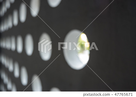 Blurred decoration round holes on the wall Blurred decoration round holes on the wall 47765671