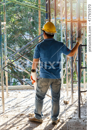 foreman with blueprint in construction site 47765970
