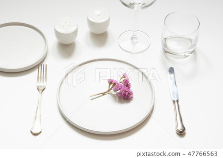 Elegance table setting with flowers on white table 47766563