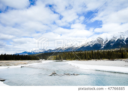 Winter Canadian · Rocky river and mountains of the Cooty National Park 47766885