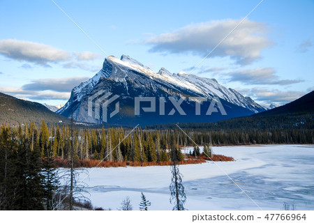 Winter Canadian · Rocky Mountain of cascades at dusk and Vermillion · Lake 47766964