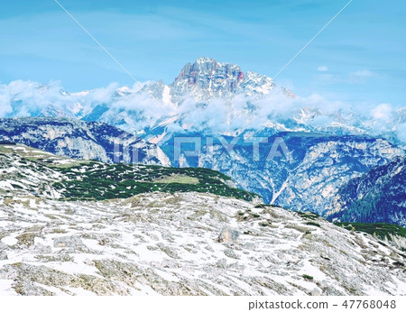 Hiking by path covered partial by snow or ice 47768048