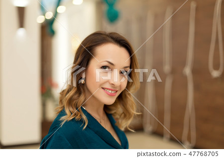 Portrait of gorgeous woman yoga trainer posing in  47768705