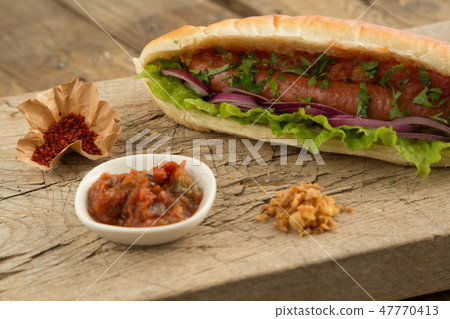 French bun hotdog with sausage 47770413