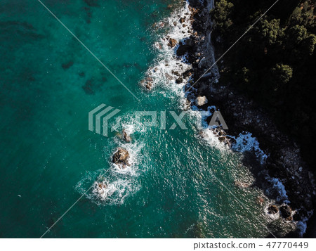 Drone top view of a sea cliff and a beach 47770449