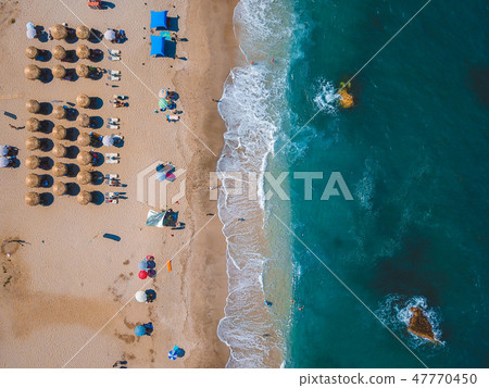 Beach with sun loungers on the coast of the ocean 47770450