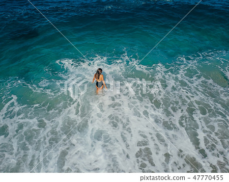 Aerial top view young woman on the sand beach Aerial top view young woman on the sand beach 47770455