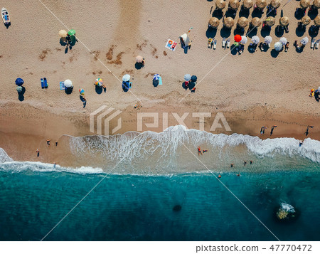 Beach with sun loungers on the coast of the ocean 47770472
