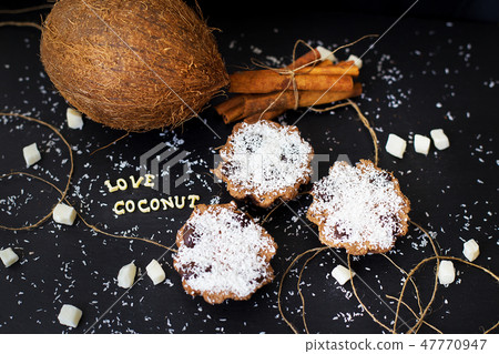 coconut muffins on a black background coconut muffins on a black background 47770947