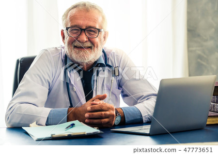 Doctor working in hospital office. 47773651