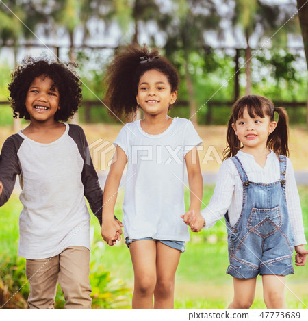 Happy kids group playing in the park in school. 47773689