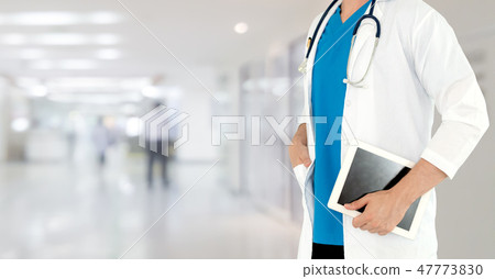 Doctor using tablet computer at the hospital. Doctor using tablet computer at the hospital. 47773830