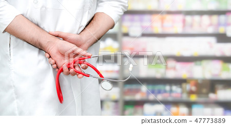 Male pharmacist working at the pharmacy. 47773889