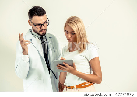 Male Doctor and Female Patient in Hospital. Male Doctor and Female Patient in Hospital. 47774070