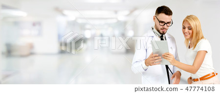 Doctor talking to patient in the hospital. Doctor talking to patient in the hospital. 47774108