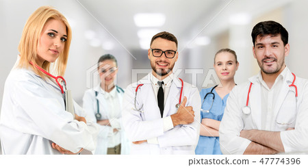 Doctor working in hospital with other doctors. Doctor working in hospital with other doctors. 47774396